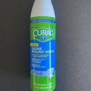 2  bottles of Curad sterile saline wound wash